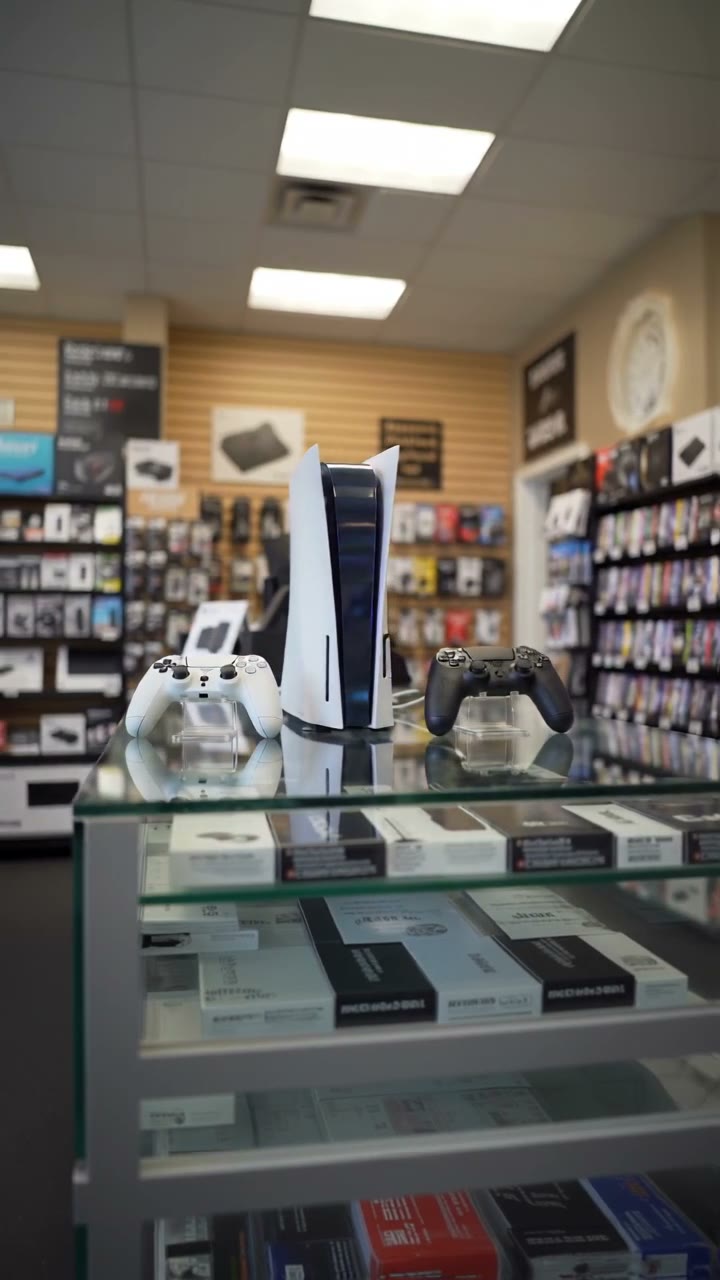 PlayStation 5 console with controllers in store
